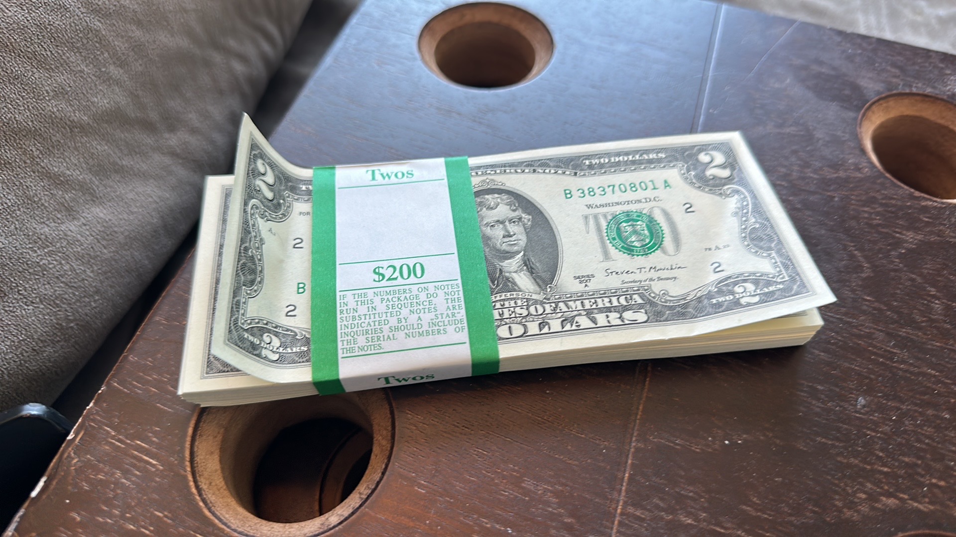 A $200 bank strap of two-dollar notes